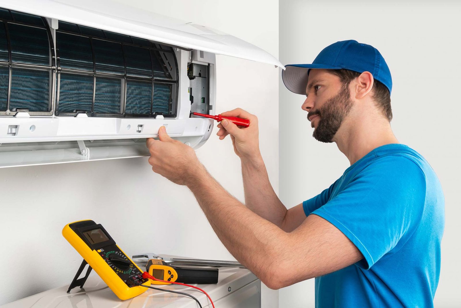 Technician repairing AC at Urban Repair Service
